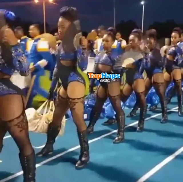Cheerleaders from a high school in Miami strut onto the football field wearing lingerie costumes